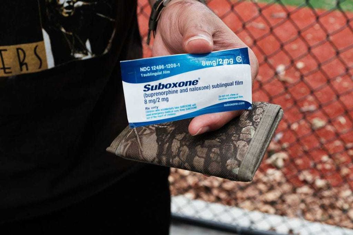 A heroin user holds suboxone near where John Jay College of Criminal Justice students are interviewing heroin users as part of a project to interview Bronx drug users in order to compile data about overdoses on August 8, 2017 in New York City. The Bronx was the borough with the highest number of overdose deaths in 2016 with 308 residents. The students interview their subjects in a park and ask questions about their history of drug use and if they have overdosed.The subjects receive a small financial compensation for the research. (Photo by Spencer Platt/Getty Images)
