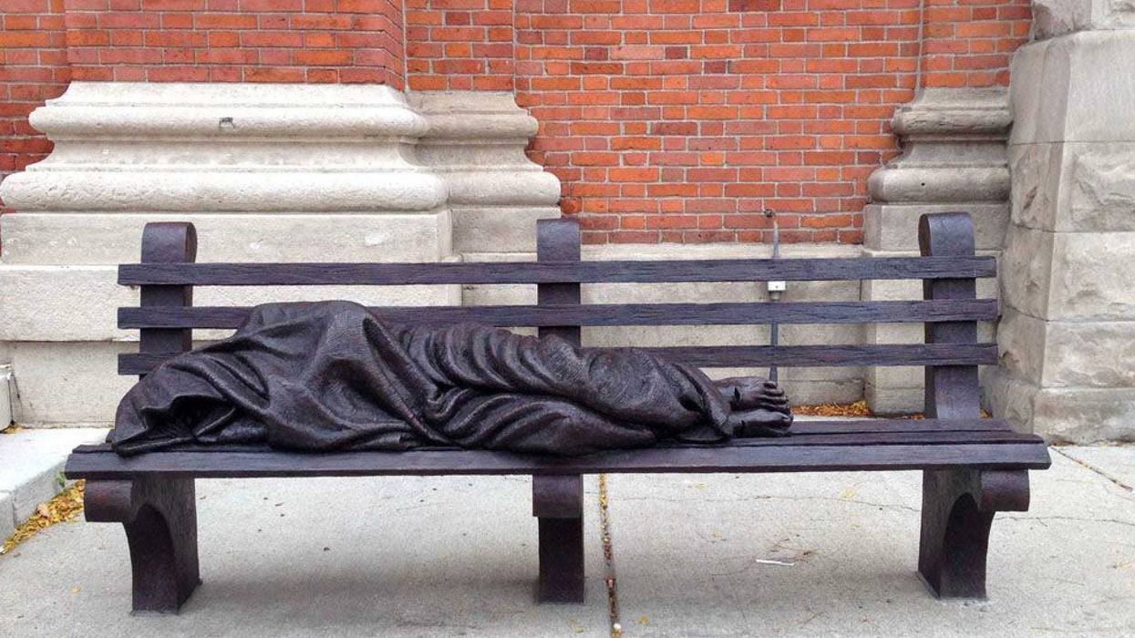 A \"Homeless Jesus\" statue is in front of Saints Peter and Paul Jesuit church in downtown Detroit. St Peter Paul Jesuit3