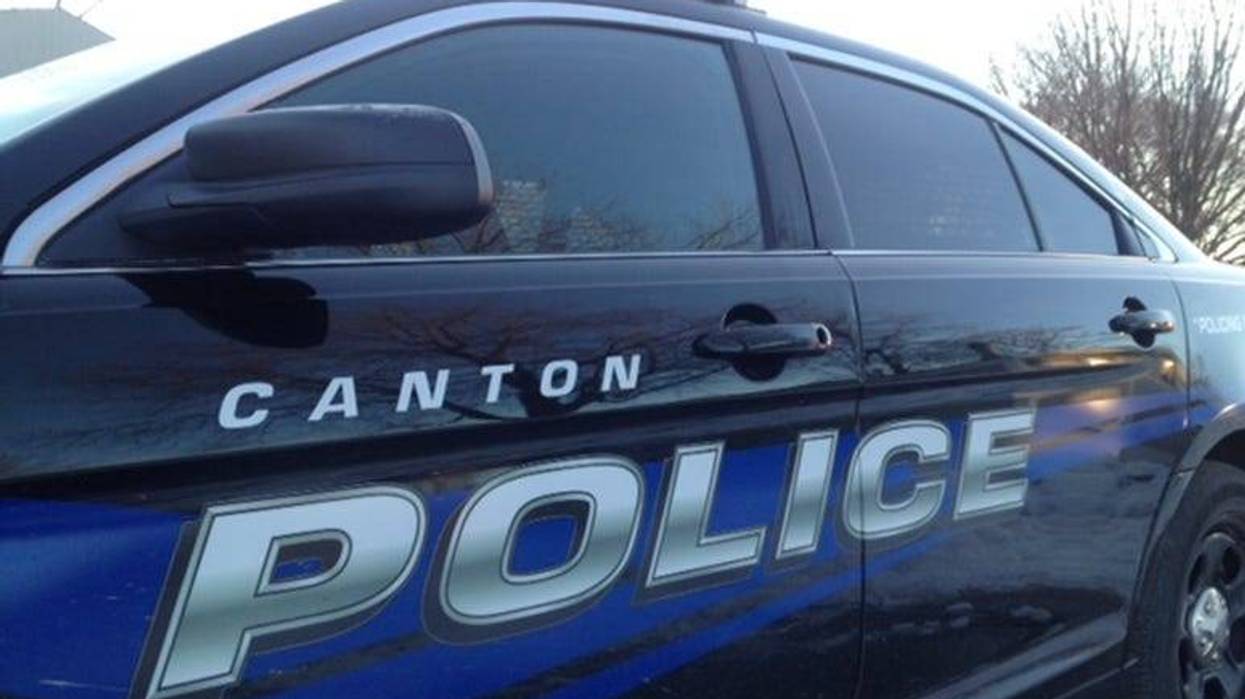 A hospitalized patient involved in a pedestrian crash on Friday night was arrested after police identified him as a shooting suspect who allegedly killed a 19-year-old woman at a Canton hotel.