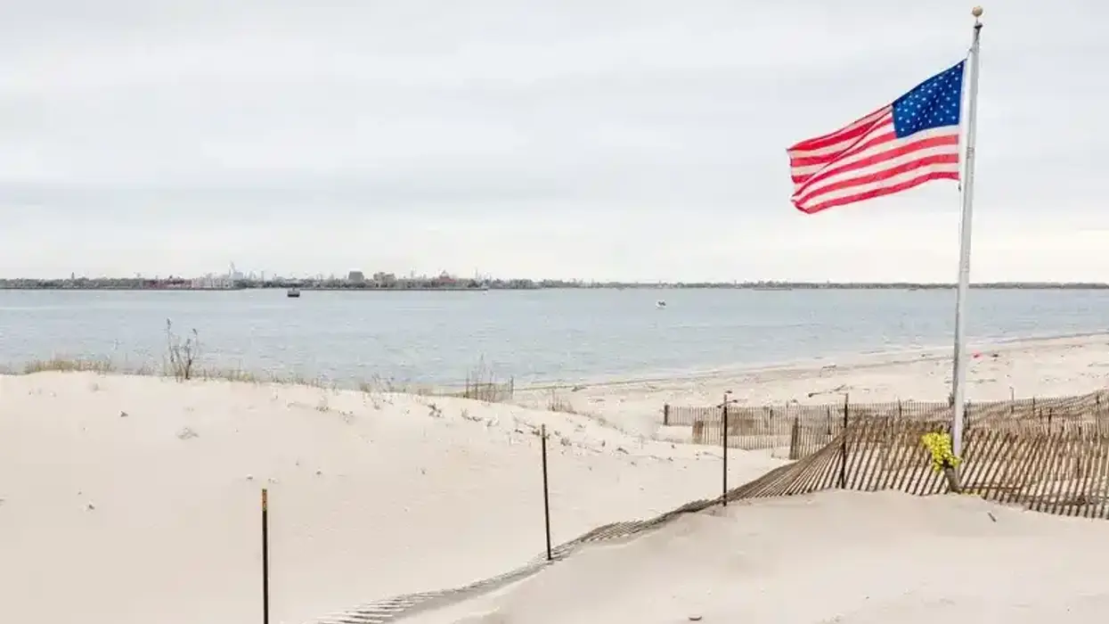 A human torso with attached legs was found at Breezy Point Beach in Queens Friday, police said.
