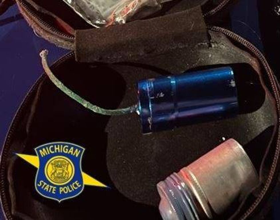 A hunch by troopers in Northern Michigan proved right after they conducted a traffic stop on a suspected drug deal and found not only drugs, but firearms and a homemade bomb, officials said.
