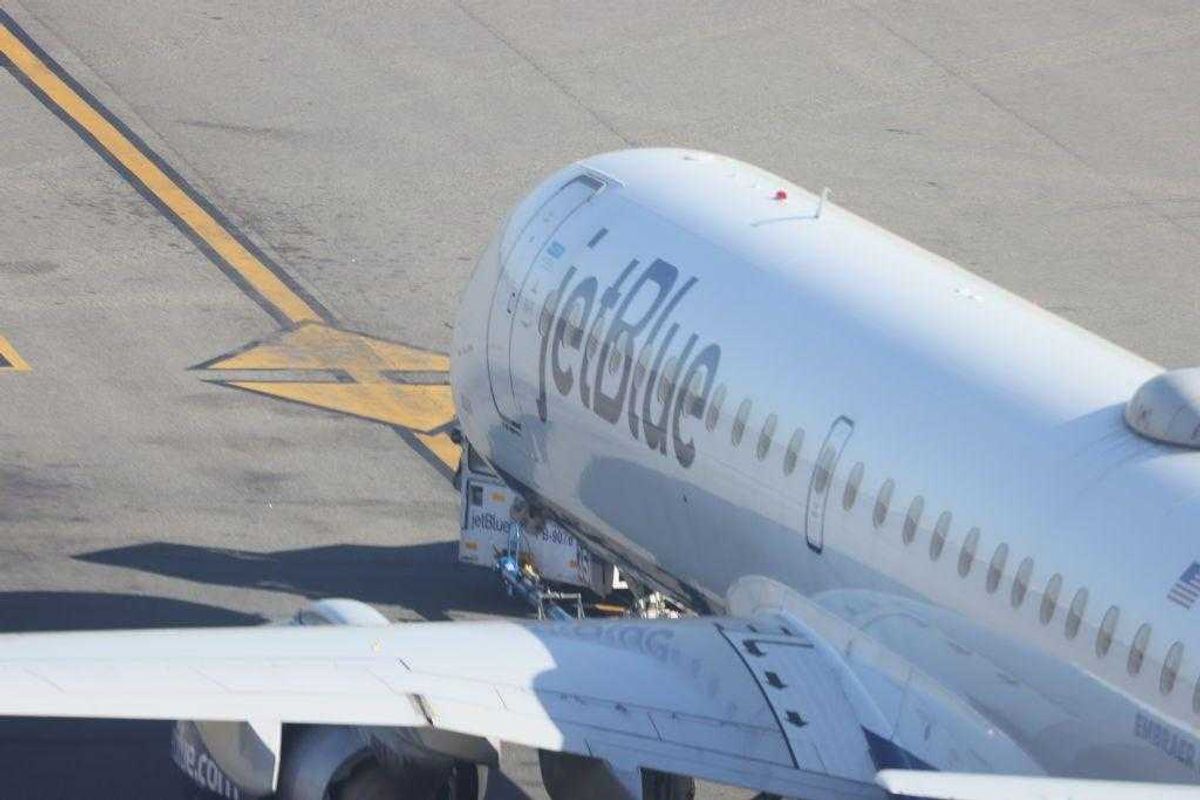 A JetBlue jet moves along the runway at Laguardia AIrport on November 10, 2022 in the Queens borough of New York City.