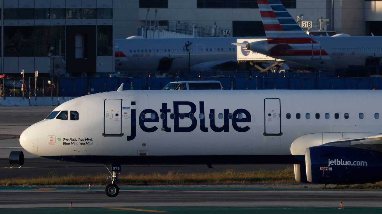 A JetBlue plane taxis at Los Angeles International Airport