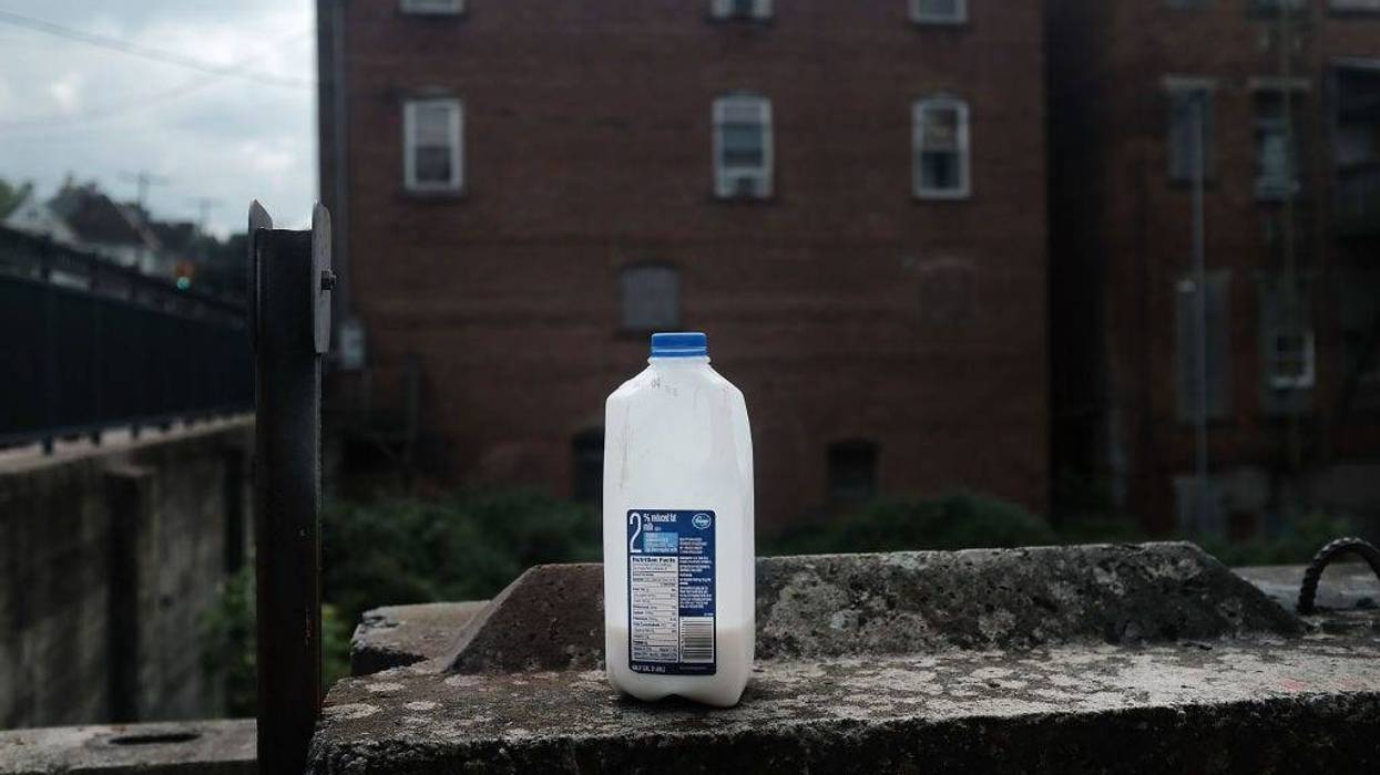 A jug of milk sits along a wall in Clarksburg on August 22, 2018 in Clarksburg, West Virginia.