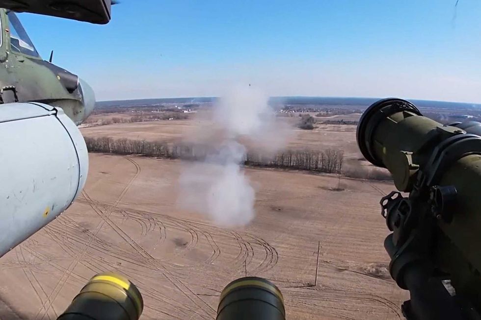A Kamov Ka-52 helicopter of the Russian Aerospace Forces carries out air strikes on a weapons depot of the Armed Forces of Ukraine