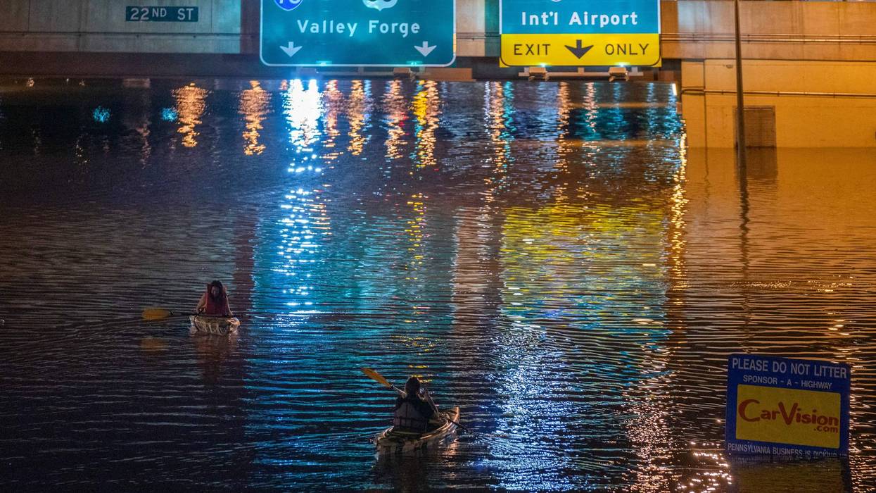A kayaker paddles down a portion of I-676 in Philadelphia after flooding from Hurricane Ida's heavy rains in September 2021.
