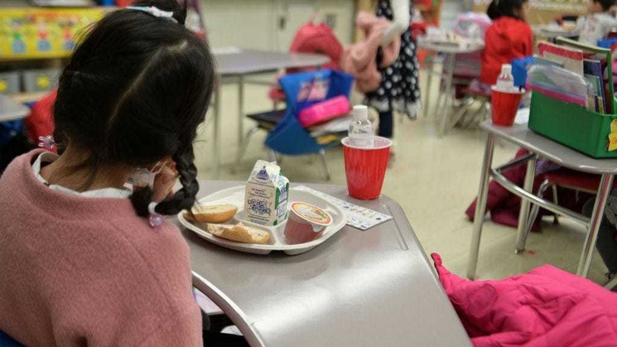 A kindergarten student eating breakfast at Yung Wing School P.S. 124 on January 13, 2021 in New York City.