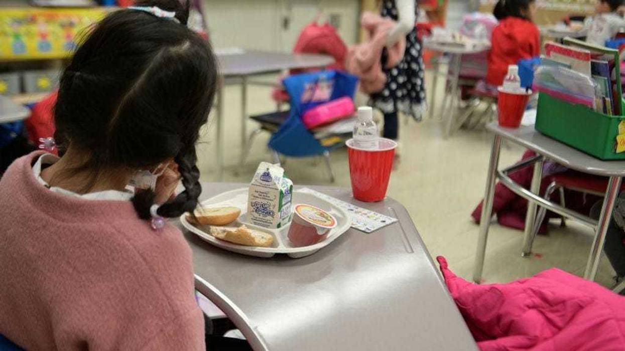 A kindergarten student eating breakfast at Yung Wing School P.S. 124 on January 13, 2021 in New York City.