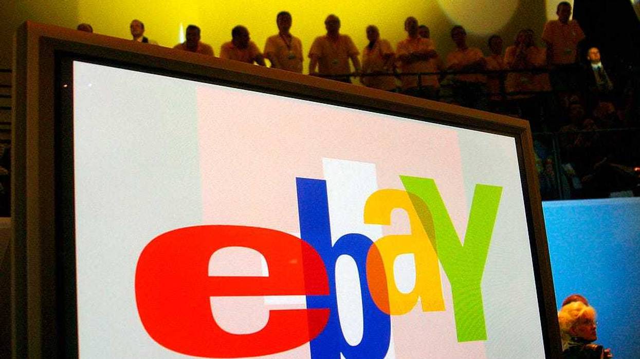 A large monitor display the Ebay logo as fans watch entertainers at an Ebay Live event on September 27, 2003 in Berlin, Germany.