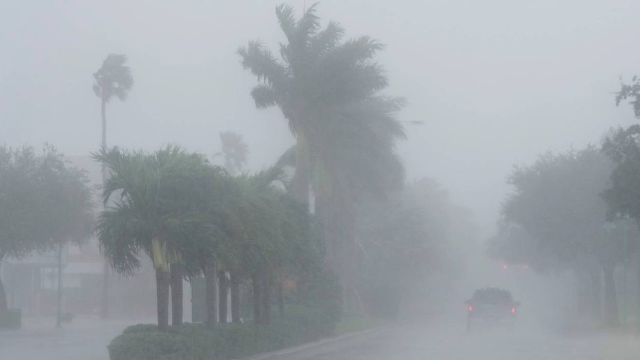 A Lee County Sheriff's officer patrols the streets of Cape Coral, Fla., as heavy rain falls ahead of Hurricane Milton, Wednesday, Oct. 9, 2024.