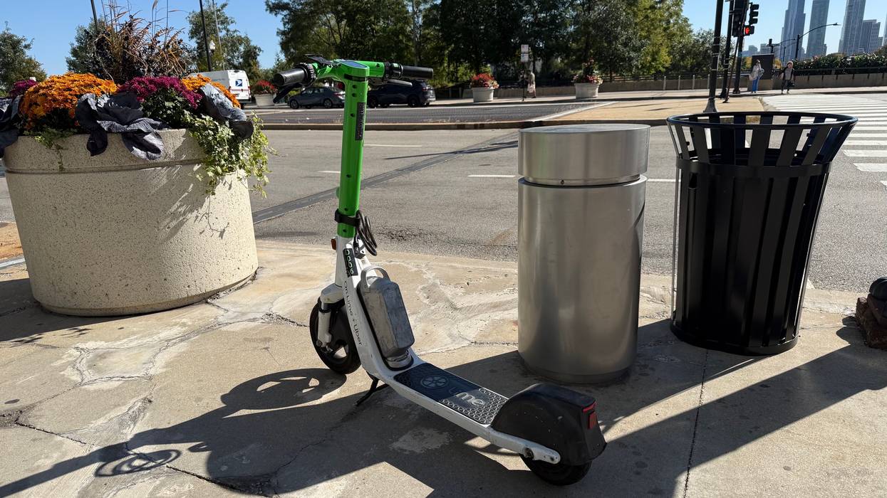 A Lime scooter awaits its next rider along East Randolph Street.