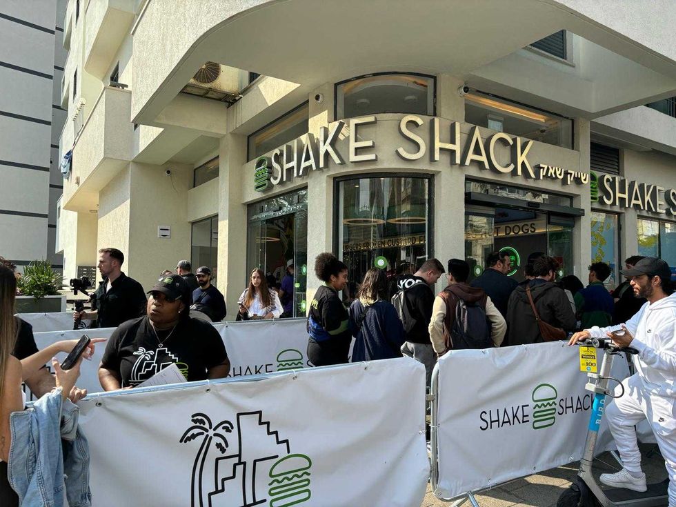 A line snakes around the corner at the Shake Shack in Tel Aviv on Feb. 27, 2024.