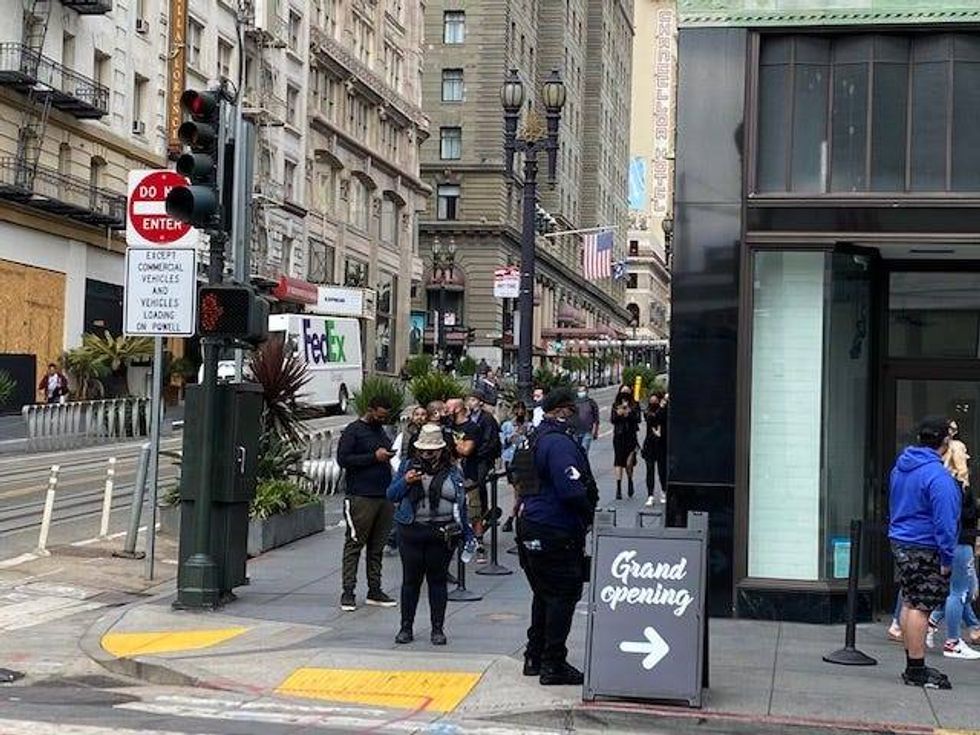 A line snakes around the corner for the grand opening of Stiiizy cannabis dispensary in San Francisco