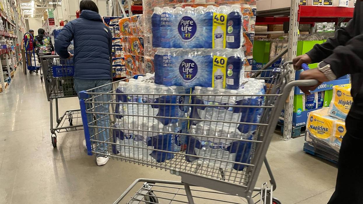 A long line of customers stretched across half of the Deptford, N.J., Sam’s Club, all trying to take home bottled water.