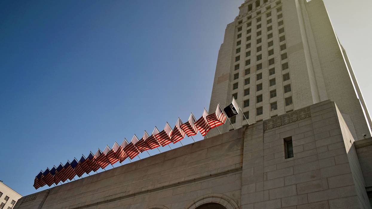 A Los Angeles City Hall building facade under blue bright sky