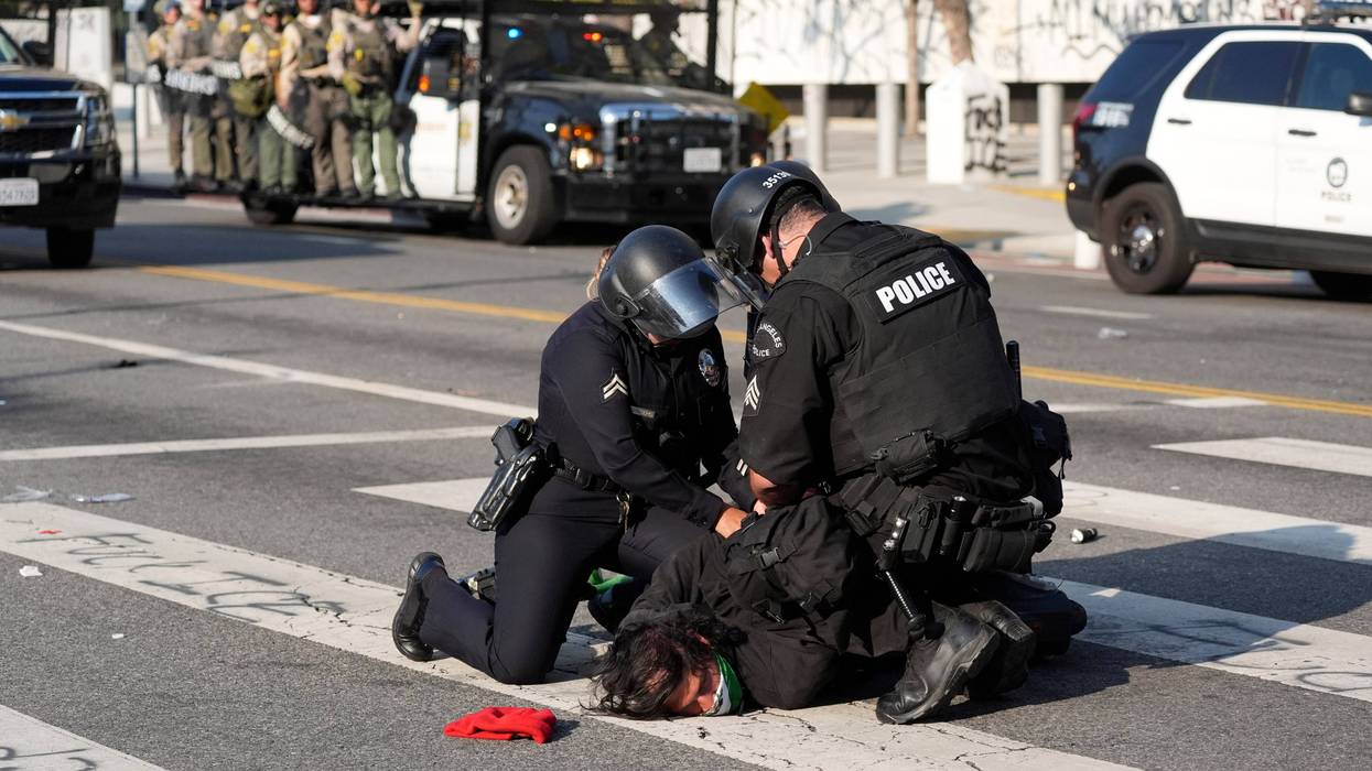 A Los Angeles police officers arrest a protester in downtown Los Angeles on Monday, June 9, 2025.
