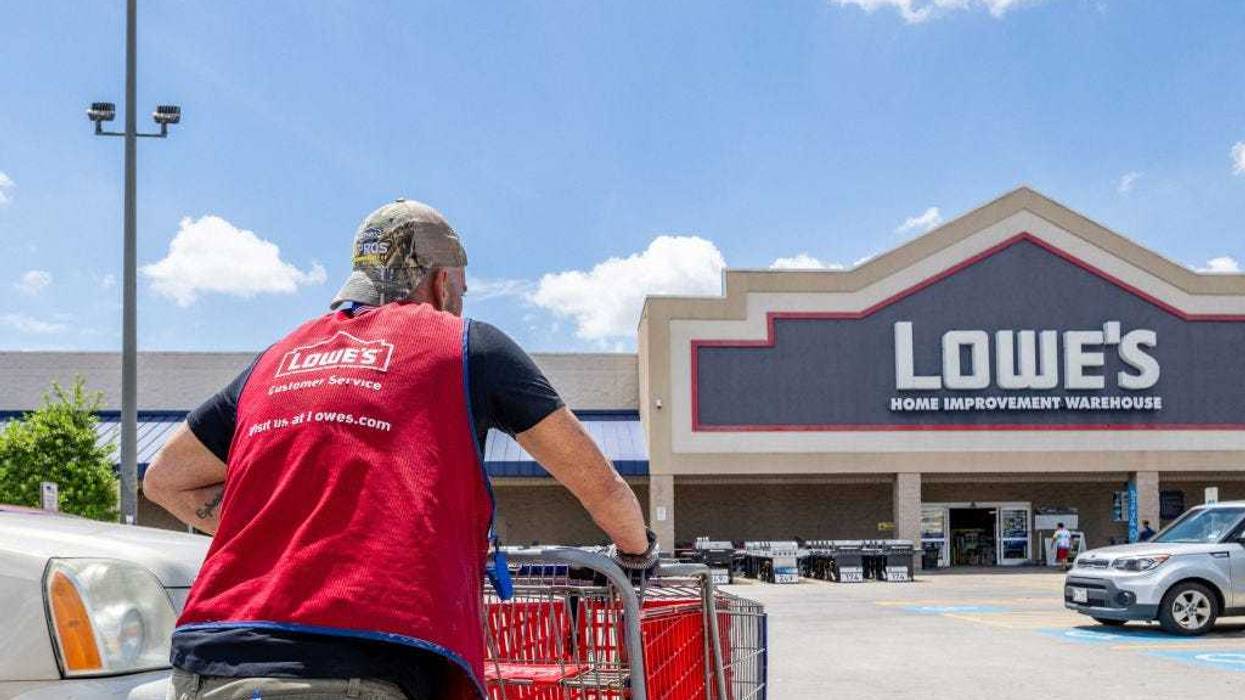 A Lowe's Home Improvement Warehouse worker collects carts in a parking lot on August 17, 2022 in Houston, Texas. Lowe's recently reported second-quarter earnings and improvements that show increased sales and the surpassing of analysts' expectations. (Photo by Brandon Bell/Getty Images)