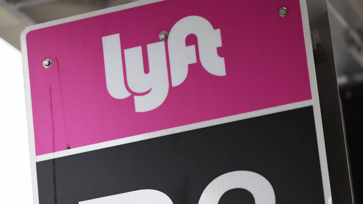 A Lyft sign is seen in the pick-up area at JFK Airport on April 28, 2023, in New York City.
