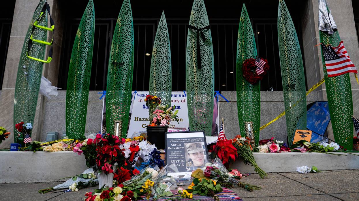 A makeshift memorial for U.S. Army Spc. Sarah Beckstrom and U.S. Air Force Staff Sgt. Andrew Wolfe is seen outside of Farragut West Station, near the site where the two National Guard members were shot, Monday, Dec. 1, 2025, in Washington.