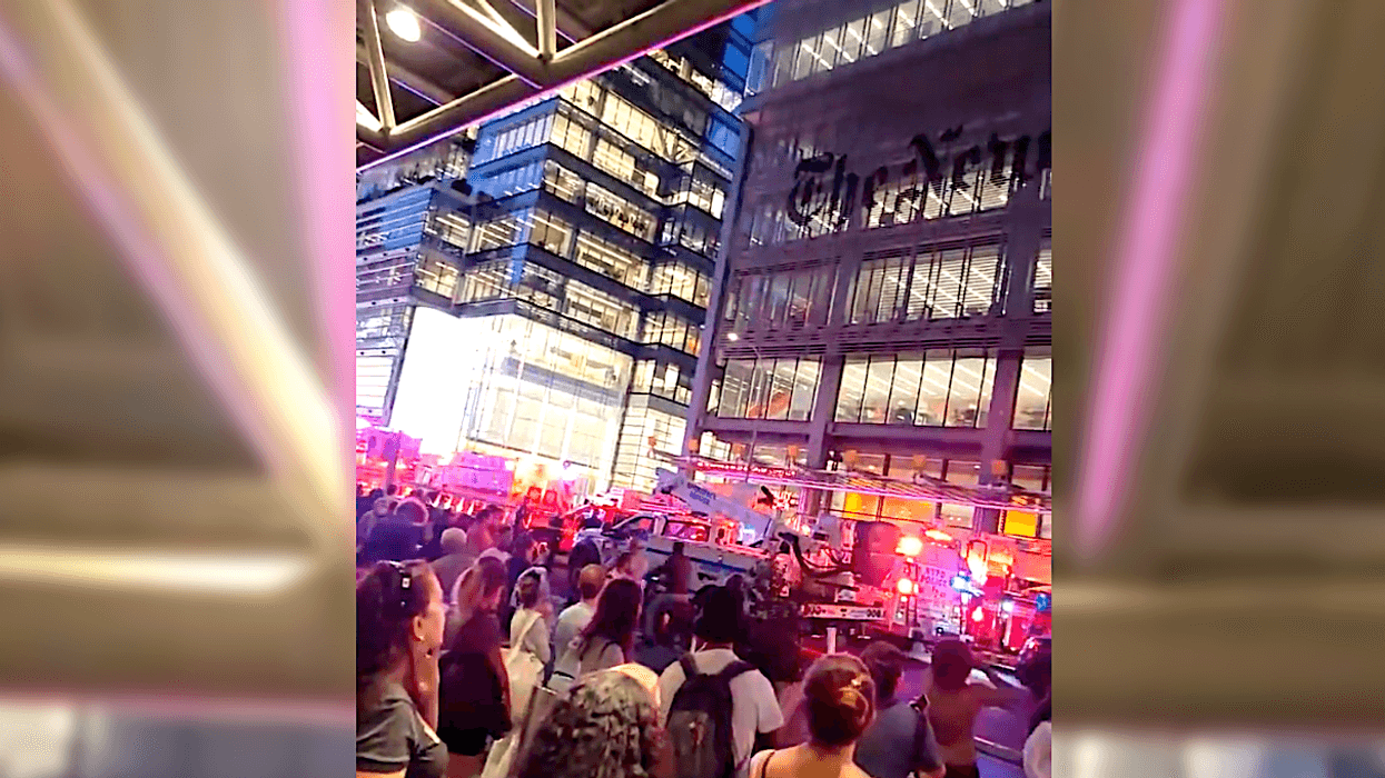 A man accused of injuring a cop with a “two-by-four riddled with nails” climbed the New York Times building Tuesday evening and threatened to harm himself with a knife, according to reports