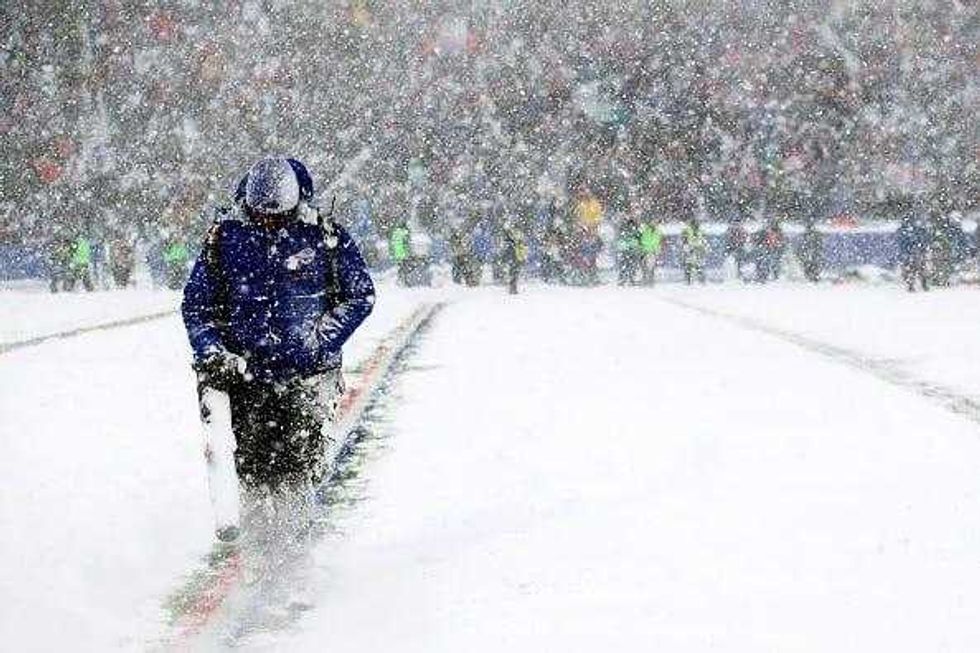 A man clears yard markers during the second quarter of a game between the Buffalo Bills and Indianapolis Colts on December 10, 2017 at New Era Field in Orchard Park, New York.