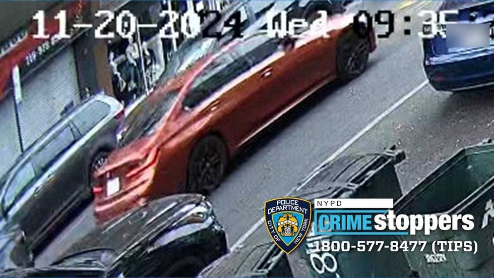 A man driving orange BMW is wanted for beating an NYPD traffic agent in Brooklyn Wednesday morning.