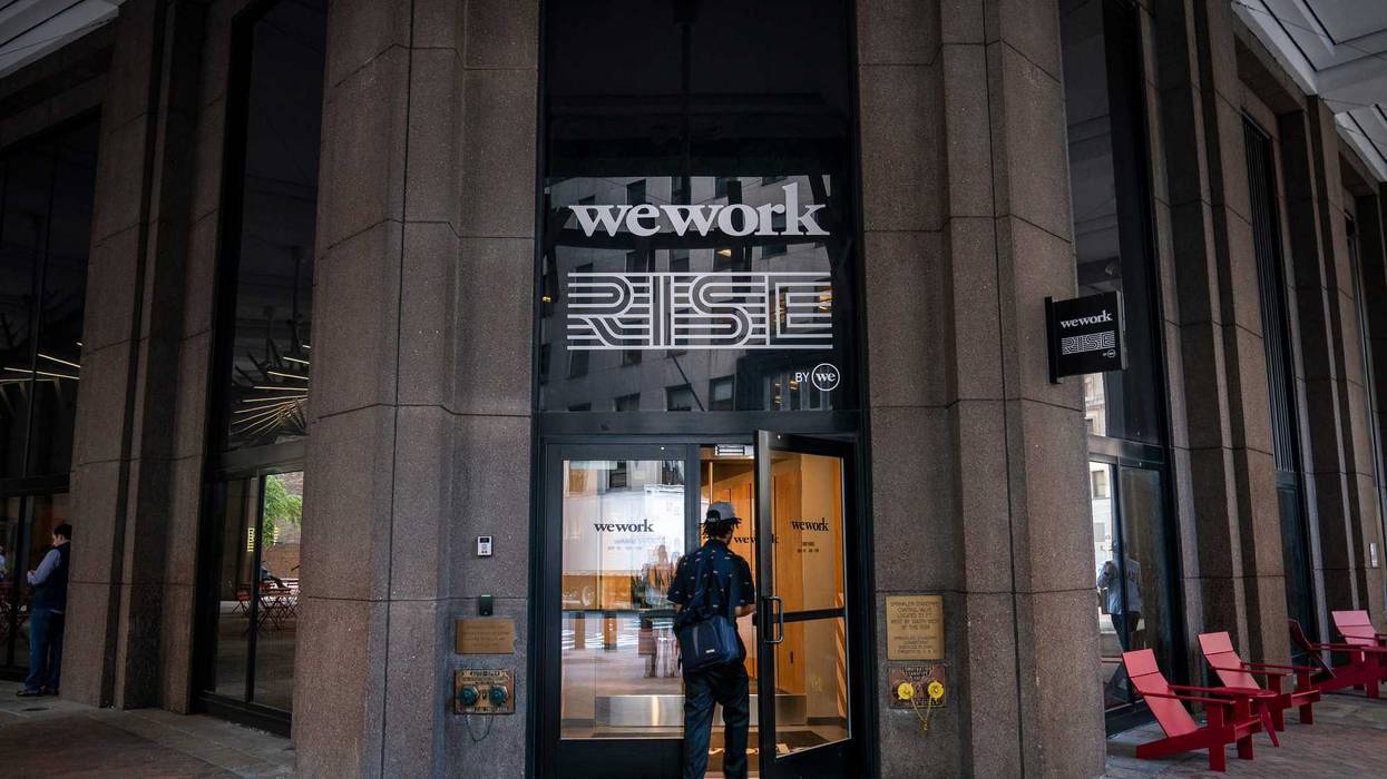 A man enters a WeWork office facility in the Financial District on Sept. 13, 2019