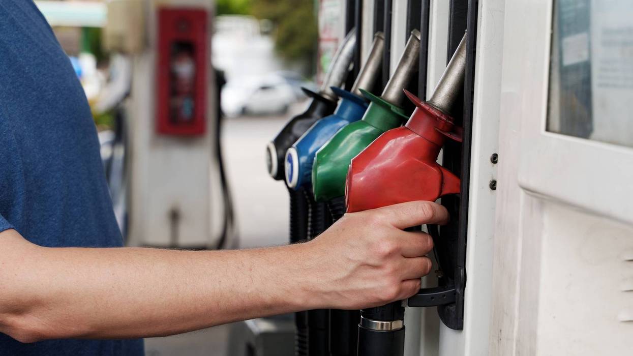 A man Filling Up at a Petrol (Gas) station