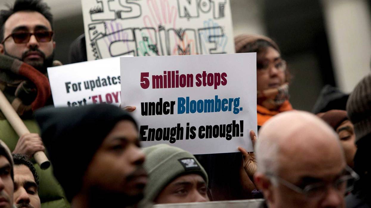 A man holds a sign during a demonstration against the city's "stop and frisk" searches in lower Manhattan near Federal Court March 18, 2013 in New York City. Hearings in a federal lawsuit filed by four black men against the city police department's "stop and frisk" searches starts today in Manhattan Federal Court.