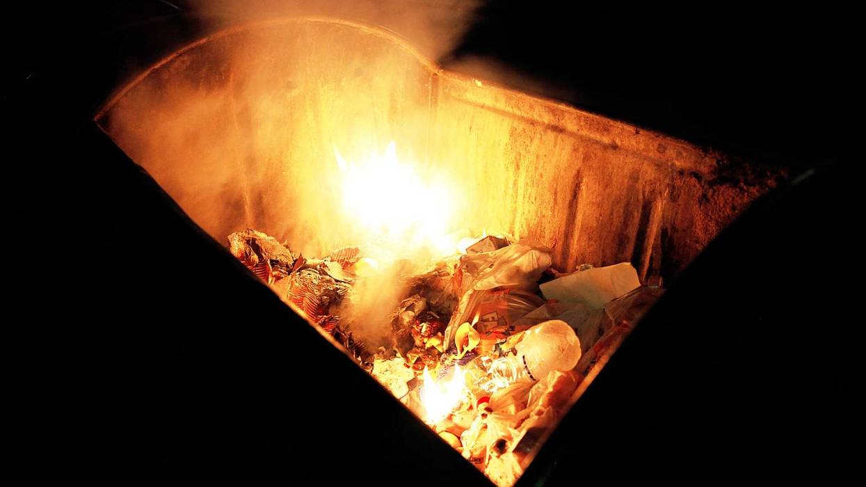 A man is in custody after a string of suspicious dumpster fires early Monday morning.