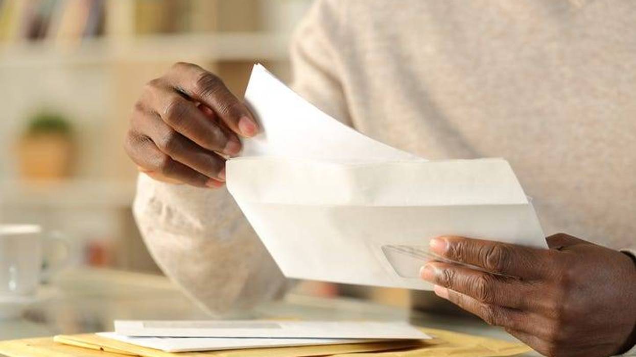 a man is reading the mail