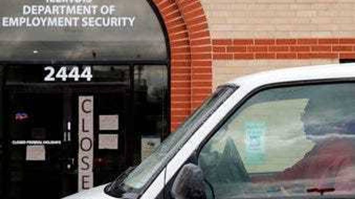 A man looks at the closed sign in front of Illinois Department of Employment Security in Chicago, Wednesday, April 15, 2020. (AP Photo/Nam Y. Huh)