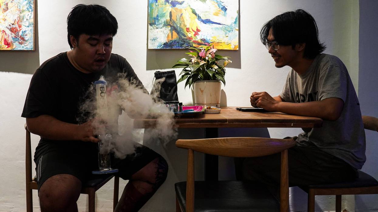 A man smokes marijuana at a cannabis lounge in Bangkok, Thailand.