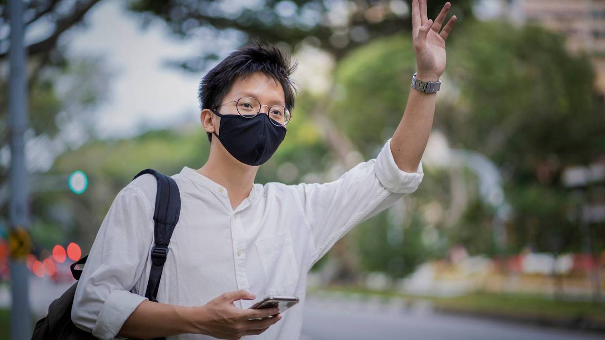 A man waiting for a rideshare.