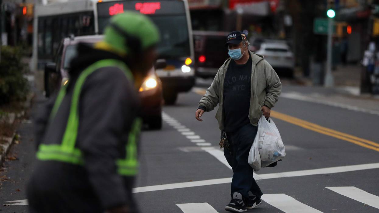A man walks along a street in Staten Island on November 12, 2020 in New York City
