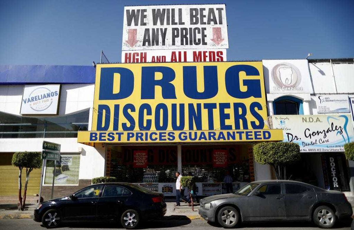 A man walks past a pharmacy on March 31, 2019 in Tijuana, Mexico. A worker at the pharmacy said around 40 percent of their customers come across the border from the United States. U.S. President Donald Trump told reporters Friday “there's a very good likelihood” that he will close the U.S. Southern border next week. (Photo by Mario Tama/Getty Images)