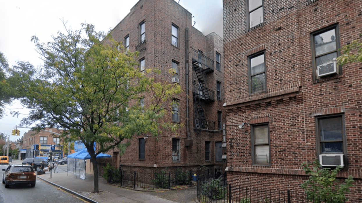A man was shot and wounded through his apartment door in Jackson Heights on Wednesday morning