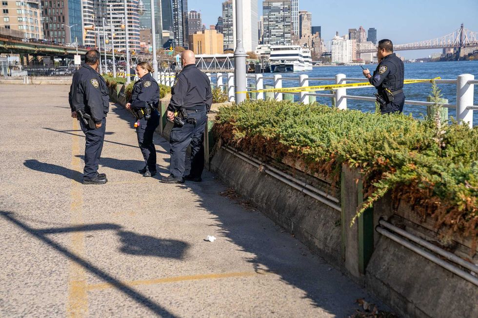 A man was stabbed to death as he was fishing along the East River