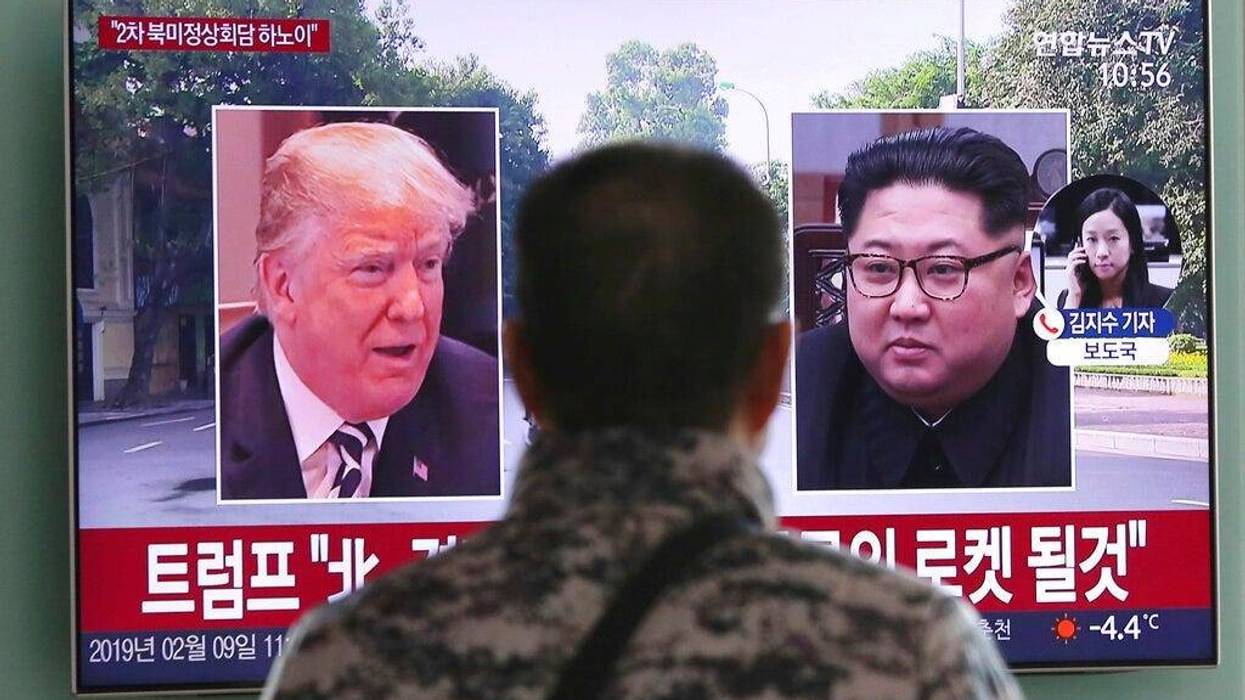 a man watches a TV screen showing images of U.S. President Donald Trump, left, and North Korean leader Kim Jong Un during a news program at the Seoul Railway Station in Seoul, South Korea