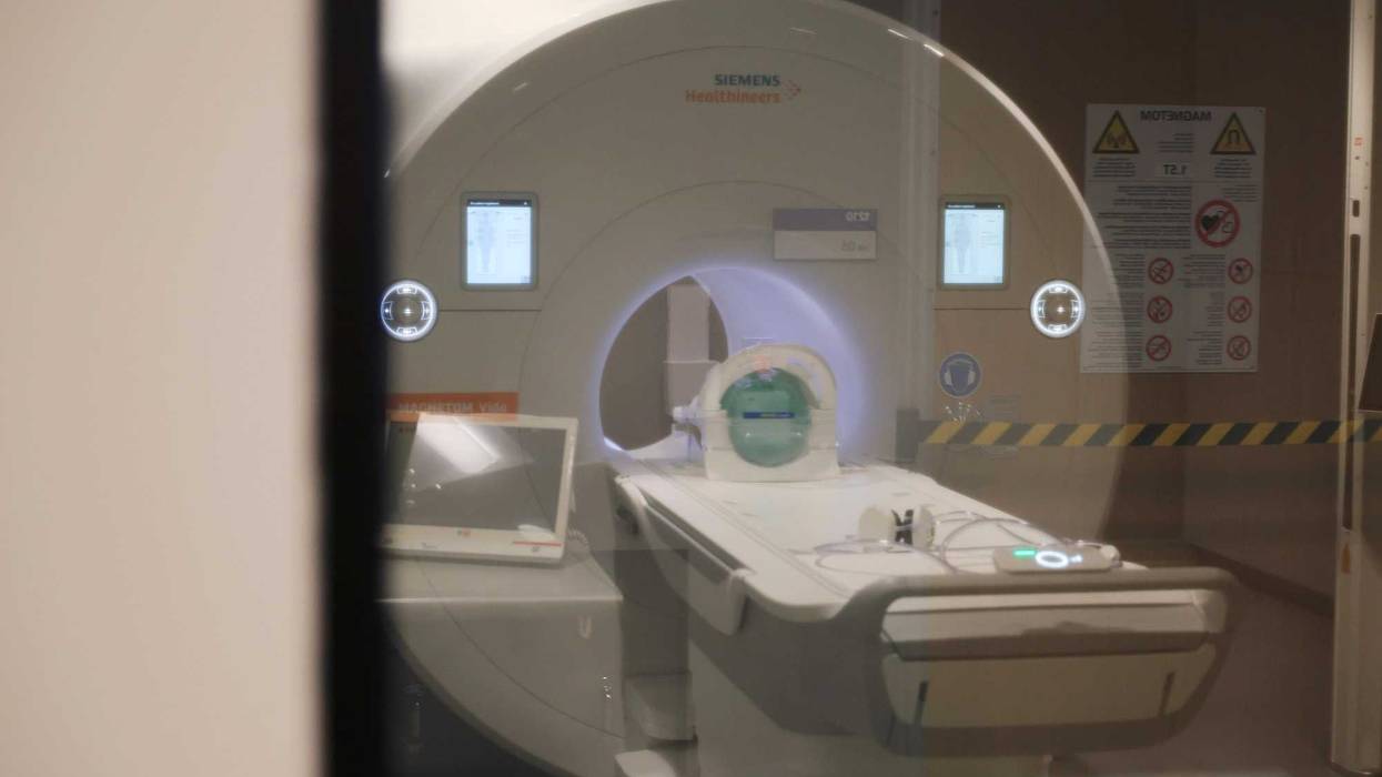 A man wearing a "large chain" died after he was sucked into an MRI machine in Westbury on Wednesday.