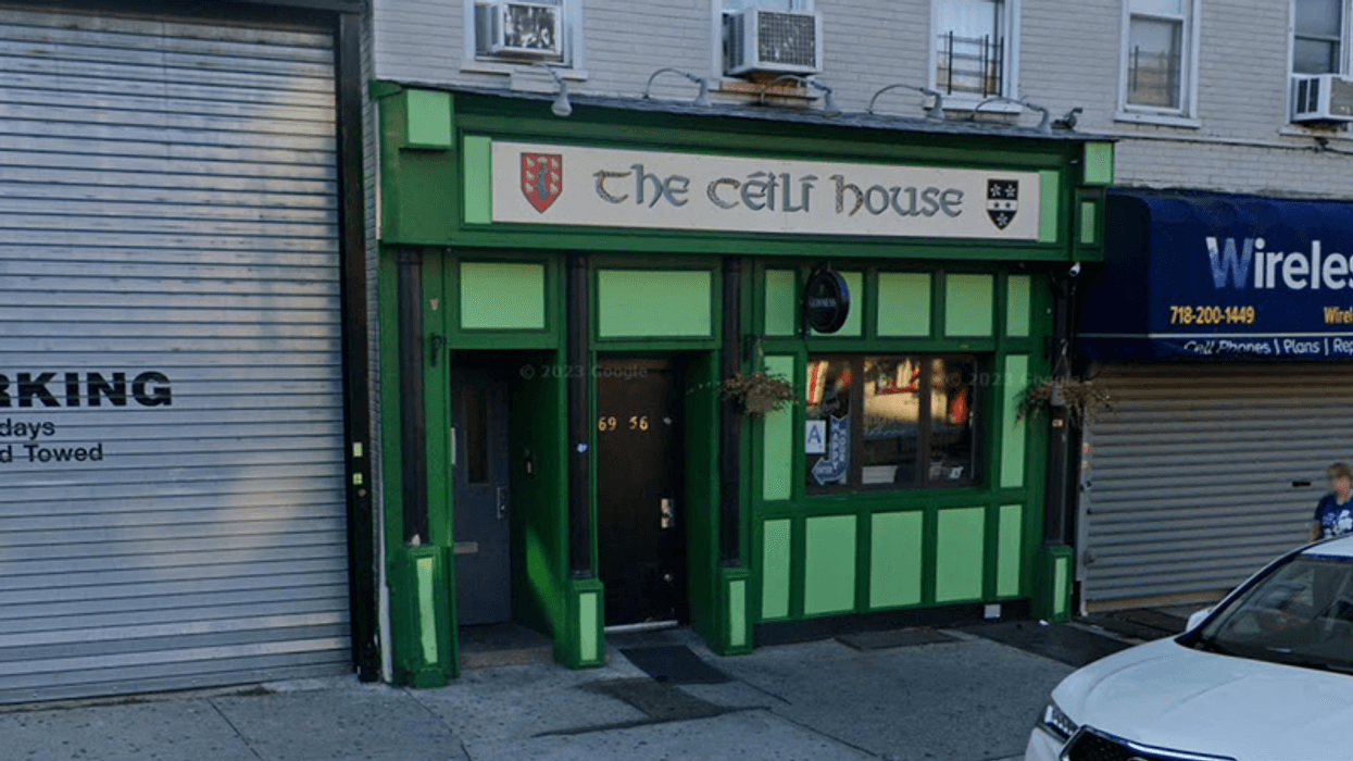 A man who is accused of stabbing his girlfriend to death before turning the knife on himself in her place of work—a pub in Queens—was hit with murder and weapons charges on Wednesday.