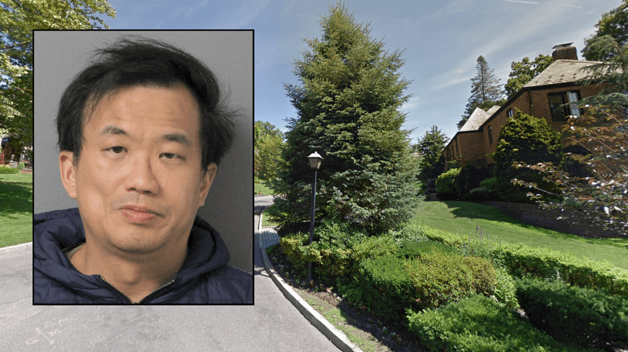 A Manhasset man was arrested for allegedly pointing a gun at a boy on his porch in what his attorney calls a misunderstanding