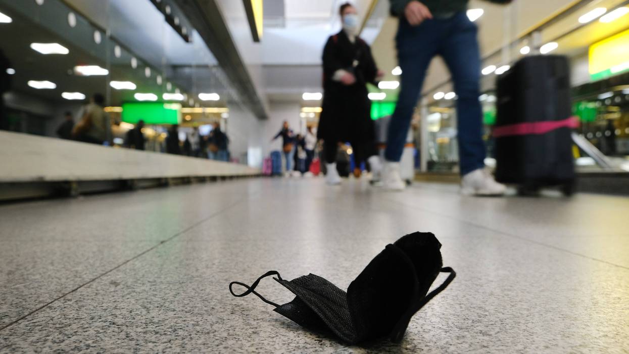 A mask is seen on the ground at John F. Kennedy Airport on April 19, 2022 in New York City.
