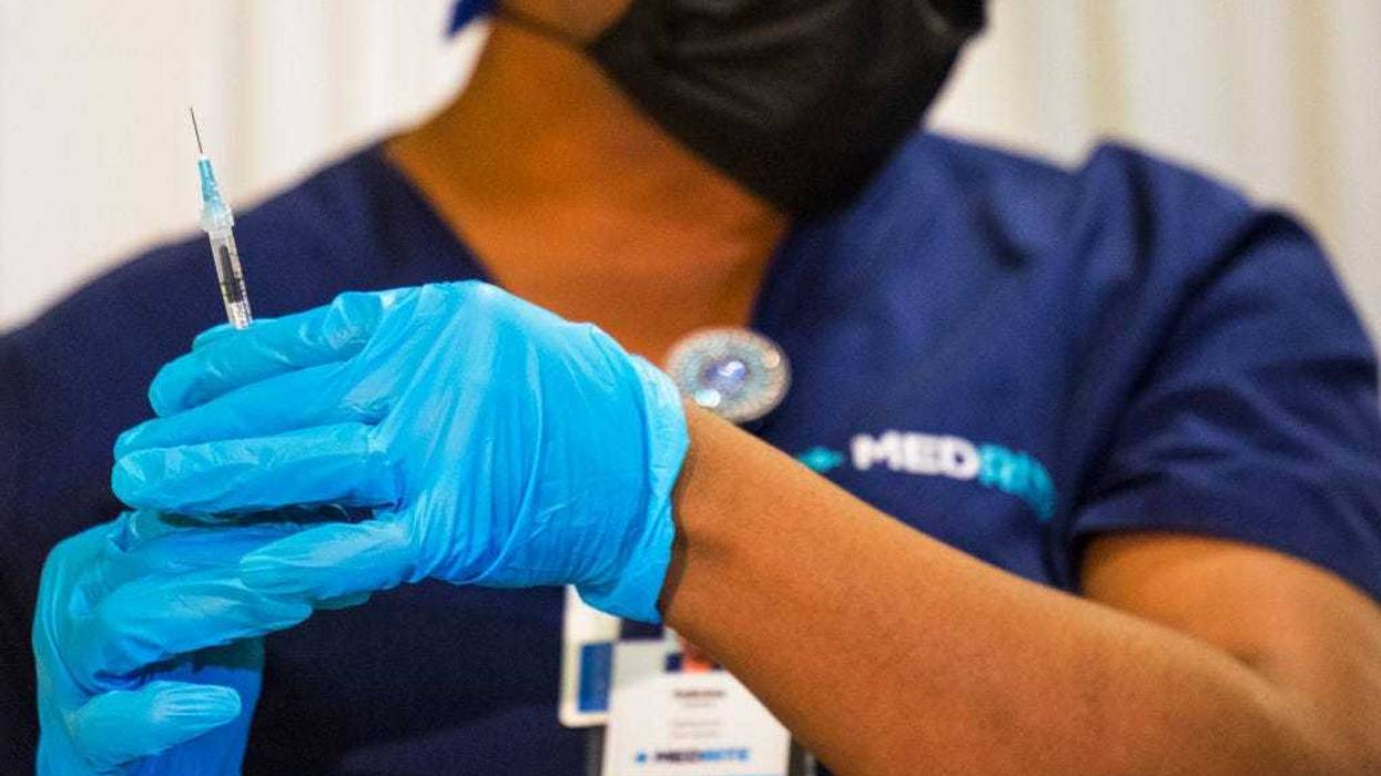 A medical staffer prepares a dose of the coronavirus (COVID-19) vaccine at a vaccination pop-up site at P.S. 19 on November 08, 2021 in the Lower East Side in New York City.