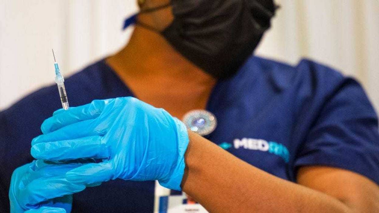 A medical staffer prepares a dose of the coronavirus (COVID-19) vaccine at a vaccination pop-up site at P.S. 19 on November 08, 2021 in the Lower East Side in New York City.