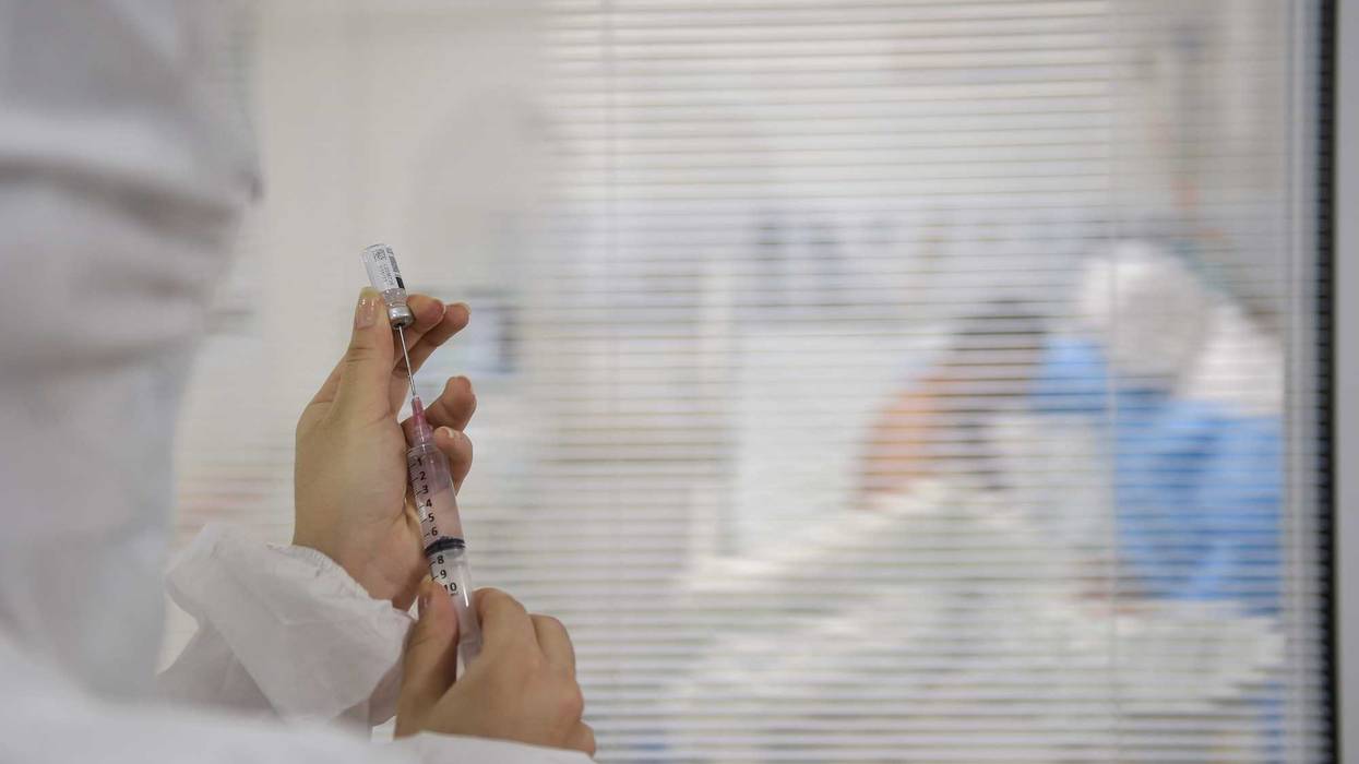 A medical team employee prepares vaccine at the ICU of Mater Dei hospital amid the coronavirus (COVID-19) pandemic on June 23, 2020 in Belo Horizonte, Brazil.