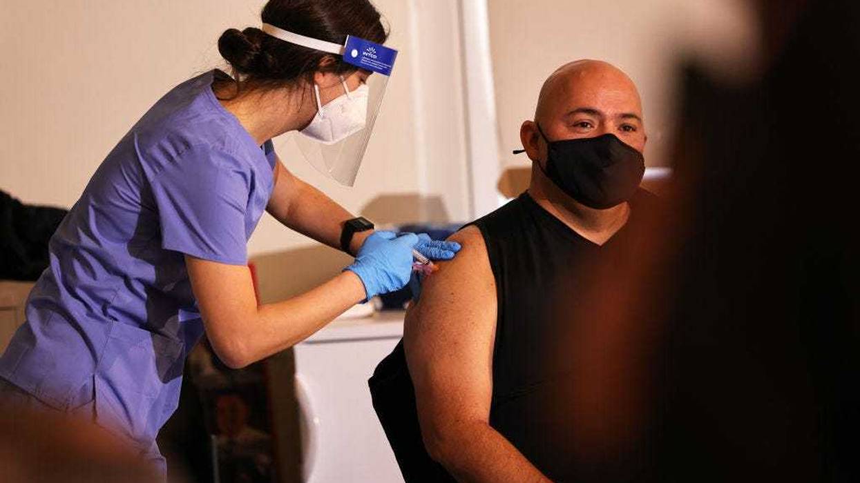 A member of FDNY EMS receives the coronavirus (COVID-19) vaccine at the FDNY Fire Training Academy on Randall’s Island on December 23, 2020 in New York City.