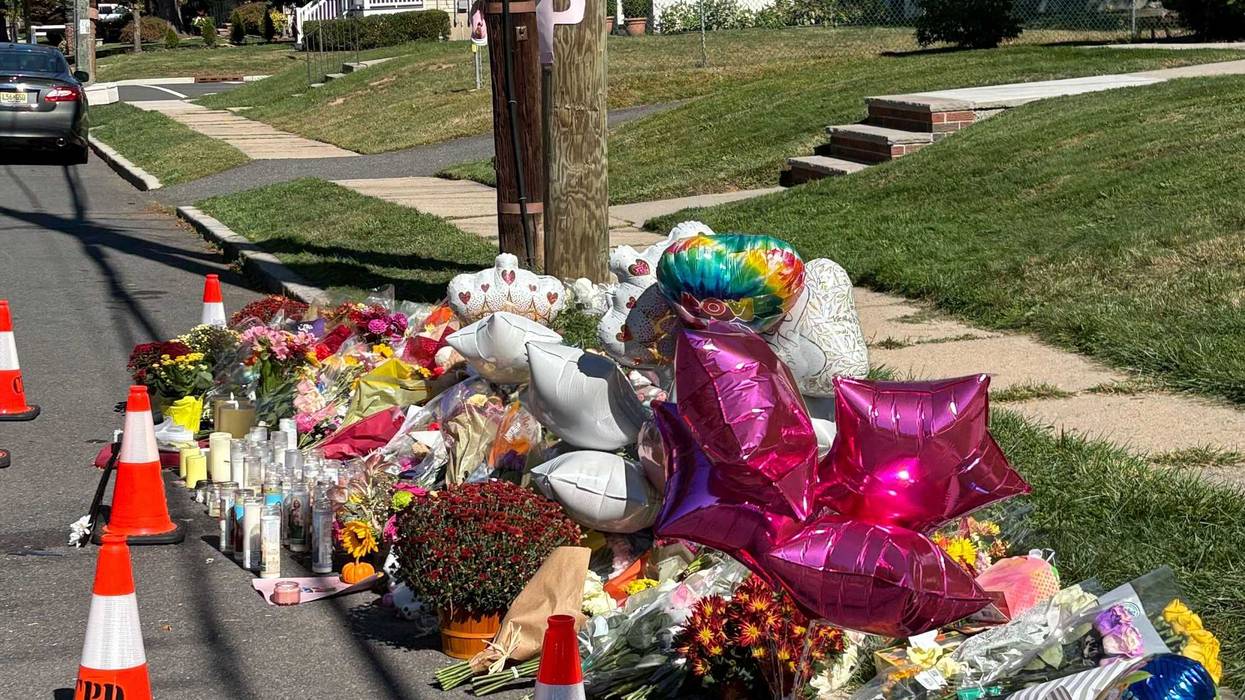 A memorial to the two girls was growing Wednesday on Burnside Avenue, with friends, family and total strangers stopping by to pray and place flowers