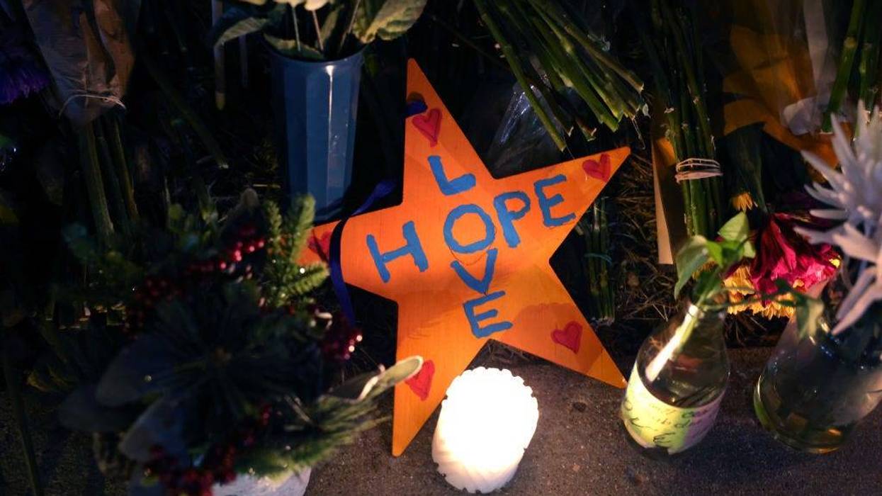A message to visitors sits at a makeshift memorial near the Club Q nightclub on November 20, 2022 in Colorado Springs, Colorado.