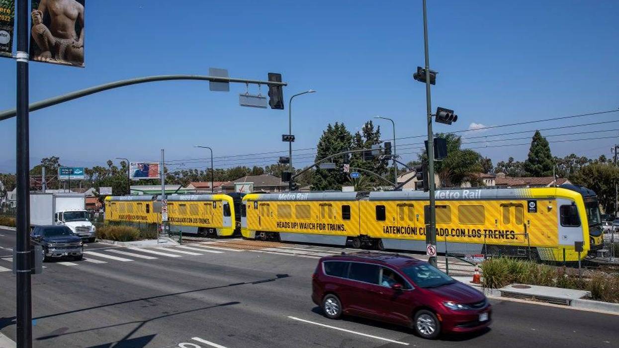 A metro train, traveling on the new K Line, makes its way along Crenshaw Blvd. in Los Angeles during a test run.